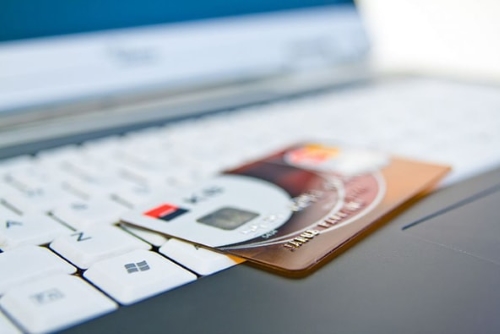 image shows a number of debit or credit cards in a pile